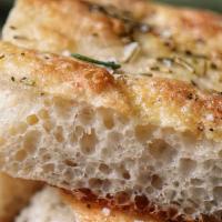 Italian Focaccia · Vegetarian. Flat oven-baked Italian bread with mixed olives and schug aioli.