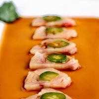 Yellowtail Jalapeno · Generous Slices of Yellowtail topped with a slice of Jalapeno Chili Pepeprs, Cilantro and Po...