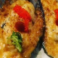 Spicy Mussels · Mussels baked with creamy imitation crabmeat, scallions and masago