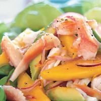 Mango Imitation Crabmeat Salad · Imitation Crabmeat, Cucumber, Mango, Radish, Spring Salad and Tobiko with Our Special sauce.