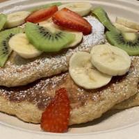 Banana, Chia Oatmeal Pancakes · Vegan, gluten-free. Topped with fresh strawberries and banana.