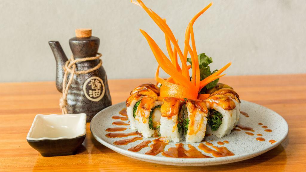 Sweet Plantain Roll (8 Pieces) · Shrimp tempura, wakame, and cream cheese topped with sweet plantains with a touch of eel sauce.