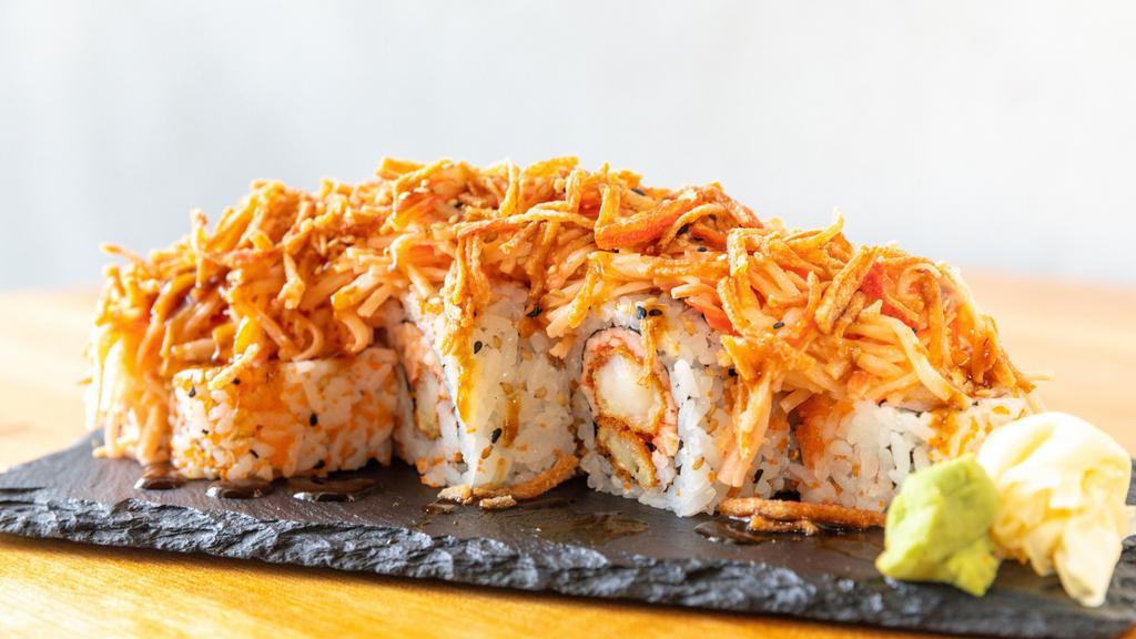 Miami Roll · Shrimp tempura, chopped crabstick, cream cheesse , sacllions, and masago. Topped with crabstick salad and crunch crab. Served with eel suace