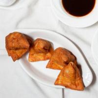 Vegetable Samosa (2 Pcs) · Refried flour tortilla stuffed with onion, potato, and vegetables and cooked.
