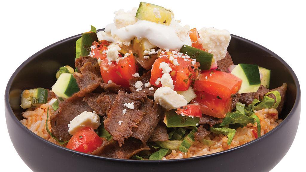 Greek Bowl · with feta, tomato & cucumber salad, & tzatziki, served over seasoned rice or lettuce