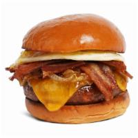 The Morning Glory Burger · Beef patty with crisp bacon, grilled  onions, melted cheddar cheese, mayo, and a fried egg o...
