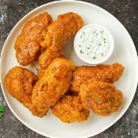 Mango Jango Habanero Wings · Fresh chicken wings, fried until golden brown, and tossed in mango habanero sauce. Served wi...