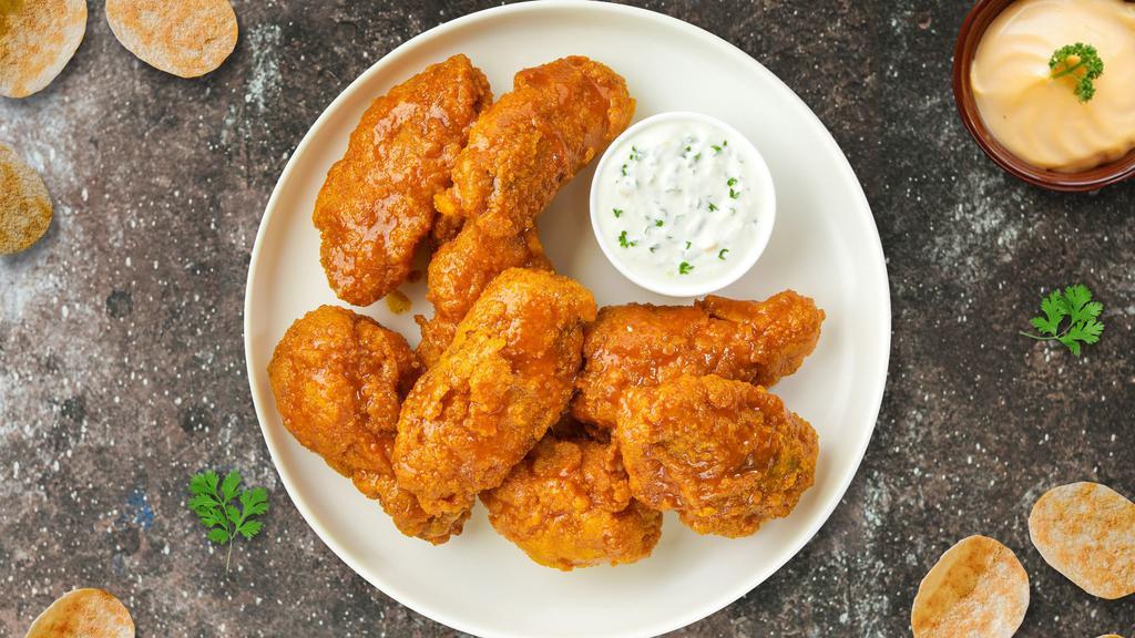 Mango Jango Habanero Wings · Fresh chicken wings, fried until golden brown, and tossed in mango habanero sauce. Served with bleu cheese dressing.