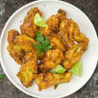 Lemon Hunter Pepper Wings · Fresh chicken wings, fried until golden brown, and tossed in lemon pepper sauce. Served with...