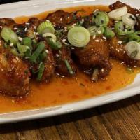 Sweet Chili Chicken Wings · Fried chicken wings glazed in sweet and spicy Asian sauce.