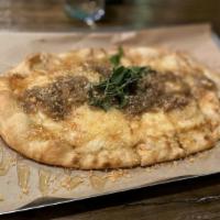 Brie Cheese And Caramelized Onions · Fresh pizza flatbread with caramelized onions, brie cheese, honey, and caramelized cashews.