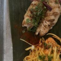 Thai Snapper · Grilled Snapper served with Asian Street Sauce and a Fresh Thai Style Green Mango Salad.