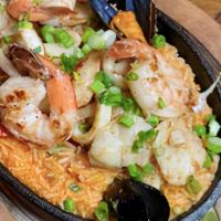 Seafood Rice · Rice in a fish and Pomodoro broth with shrimp, squid, and mussels.
