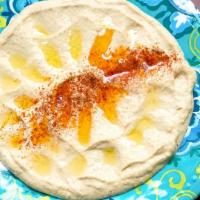 Hummus · A blend of puree chick peas delicately flavored with sesame puree, fresh lemon juice, olive ...