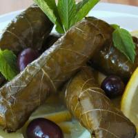 Stuffed Grape Leaves · Stuffed with rice, pine nuts, fresh herbs, served cold with tzatziki sauce.