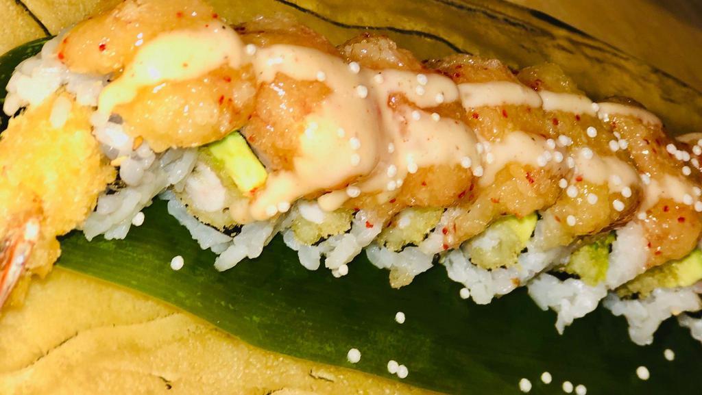 Volcano Roll · Shrimp tempura, avocado, topped with baked house sauce mixed crispy crunchy.