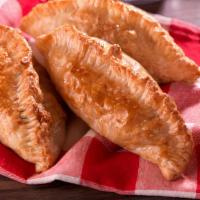 Empanada (Baked) Guava & Cheese · Baked puff pastry dough filled with guava and cheese.