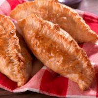 Empanada (Baked) Shredded Beef · Baked puff pastry dough filled with shredded beef.
