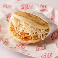 Arepa Perico · Arepa filled with scrambled eggs with onions, tomatoes, and white cheese.