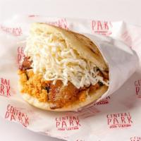 Arepa Pabellon · Arepa filled with yellow plantain, black beans shredded beef, and white cheese.