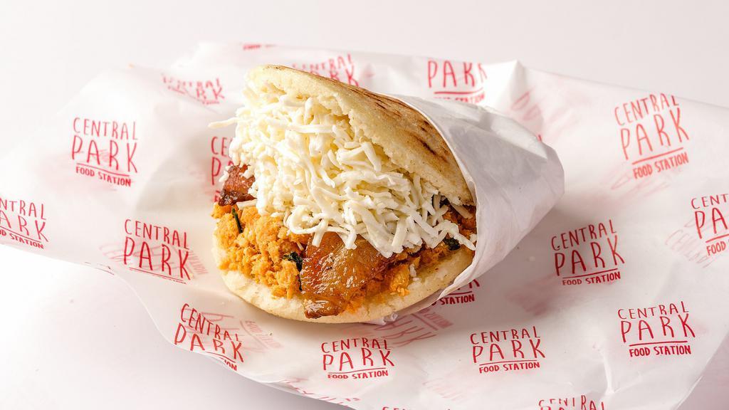 Arepa Pabellon · Arepa filled with yellow plantain, black beans shredded beef, and white cheese.