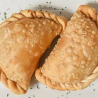 Beef Empanadas · Ground beef stuffed pastry spiced with onion and olives, Argentinean style.
