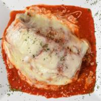 Meat Lasagna · Layers of pasta, meat and ricotta, baked in tomato sauce, melted mozzarella and parmesan.