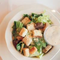 Side Caesar Salad · Tossed with Caesar dressing, croutons, romaine and Parmesan cheese.