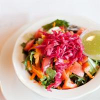 Side House Salad · Lettuce, tomatoes, onions, carrots, cabbage and choice of dressing.