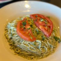 Pesto · Home-made pesto sauce, topped with fresh diced tomatoes.