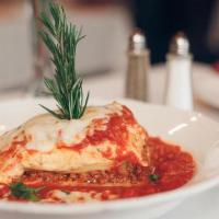 Lasagna Bolognese · A tasty combination of seasoned beef, ricotta, mozzarella and Parmesan cheeses. Topped with ...