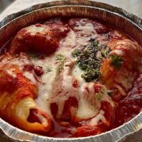 Stuffed Shells · Pasta shells filled with ricotta and Parmesan cheeses topped with a tomato-basil sauce and m...