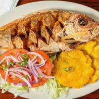 Fried Whole Snapper · Fried whole snapper served with a salad and white rice.