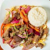 Lomo Saltado · Our signature dish! We use only the finest certified angus beef C.A.B. Sautéed with onions a...