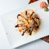 Volcano Roll · Spicy tuna lightly batter with crab meat tempura, spicy mayo eel sauce on the top.