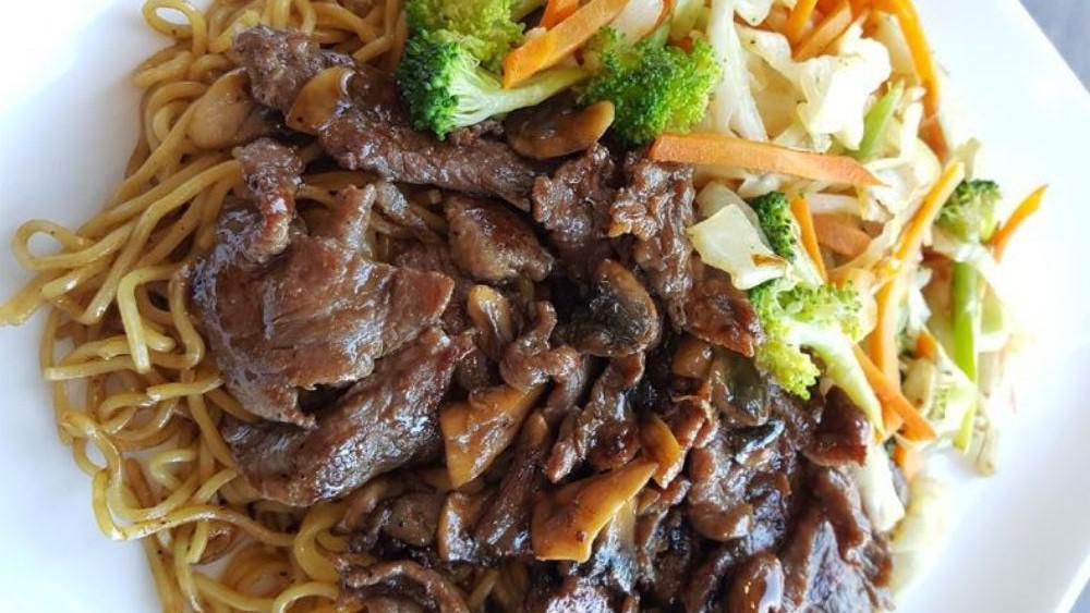 Beef Teriyaki · Grilled sliced beef with mushroom glazed with teriyaki sauce, served with  grilled mixed vegetables and steamed rice