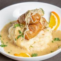 Bangers & Mash · Irish sausage on homemade mashed potatoes with sauerkraut and brown gravy