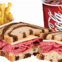 Reuben Combo · Griddled Corned Beef and Sour Kraut topped with Swiss Cheese and 1000 island dressing served...