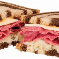Reuben · Griddled Corned Beef and Sour Kraut topped with Swiss Cheese and 1000 island dressing served...