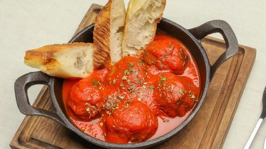 Meatballs · Served with tomato sauce, topped with ricotta cheese and farm style toasted bread.