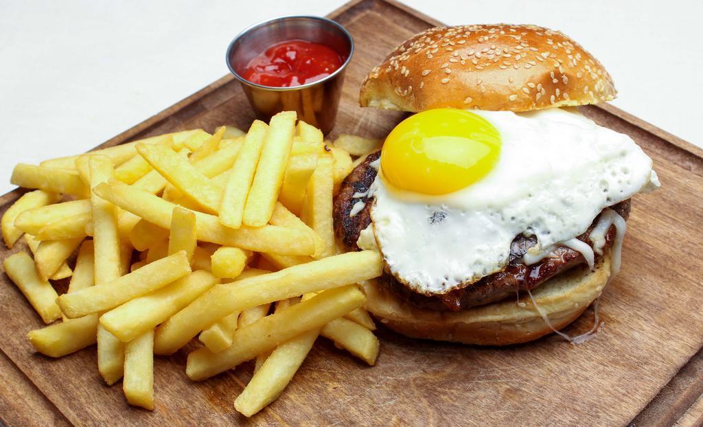 Prime Burger · Short rib-brisket blend patty, pepper jack cheese, mushrooms, caramelized onions, bacon, and sunny side up egg.