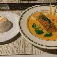 Grilled Salmon In Panang Curry Sauce · Grilled Salmon, on bed of steamed mix veggies, red curry sauce, topped with kaffir leaf, whi...
