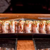 Dragon Roll · Shrimp tempura, cream cheese, topped with avocado, masago and eel sauce.