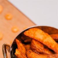 Masala Fries · House made potato wedges with fresh ground spices and herbs. Served with your choice or dipp...
