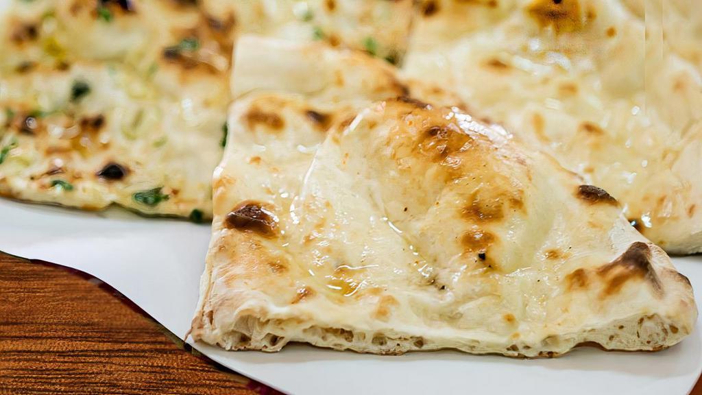 Garlic Naan (1 Each) · Tandoori flatbread w garlic.