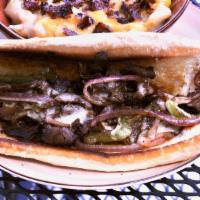 Philly Cheesesteak · Sliced sirloin, topped with onions, peppers, and provolone cheese.  Served on a toasted hoag...