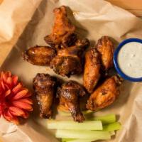Smoked Jumbo Wings (8 Pc) · Chicken wings marinated in homemade rub, smoked then fried and tossed in our medium wing sau...