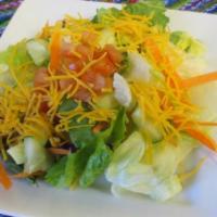 Guacamole Salad · Fresh guacamole, lettuce, tomatoes, and shredded chicken.