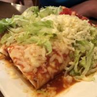 Burrito De Lujo · Two burritos chicken or ground beef with beans, topped with lettuce, tomatoes, guacamole, so...