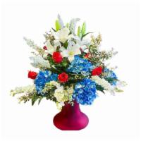 Liberty Reigns · Patriotic and gorgeous white oriental lilies, snapdragons and orchids mixed with blue hydran...